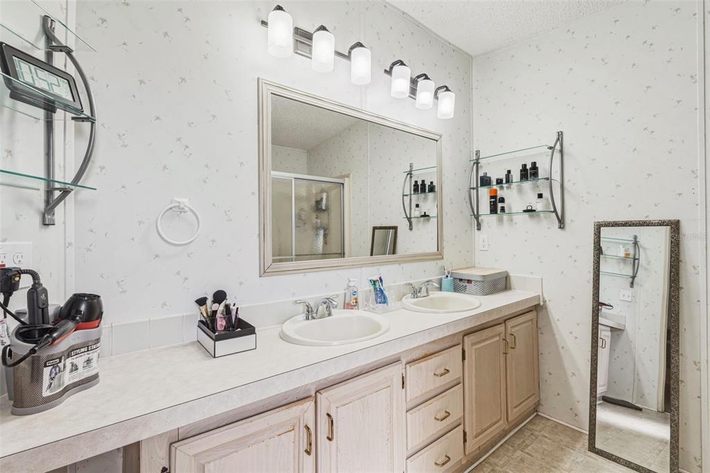 1586 Grapefruit Street Arcadia, FL 34266 - Photo 25 of 40 a bathroom with a double vanity sink double vanity