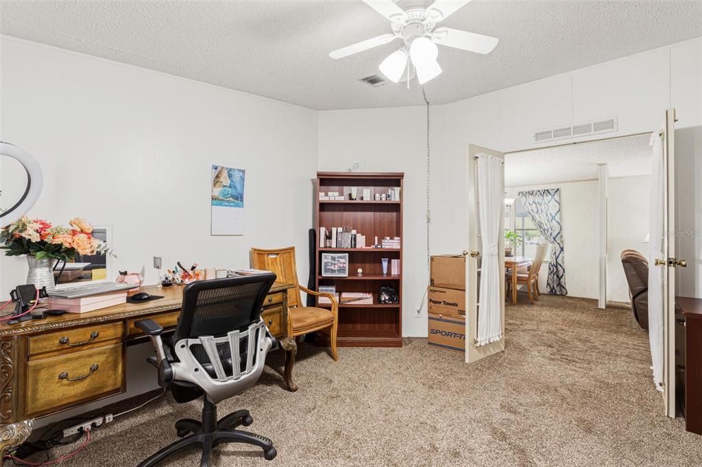 1586 Grapefruit Street Arcadia, FL 34266 - Photo 33 of 40 a view of a workspace with furniture and a window