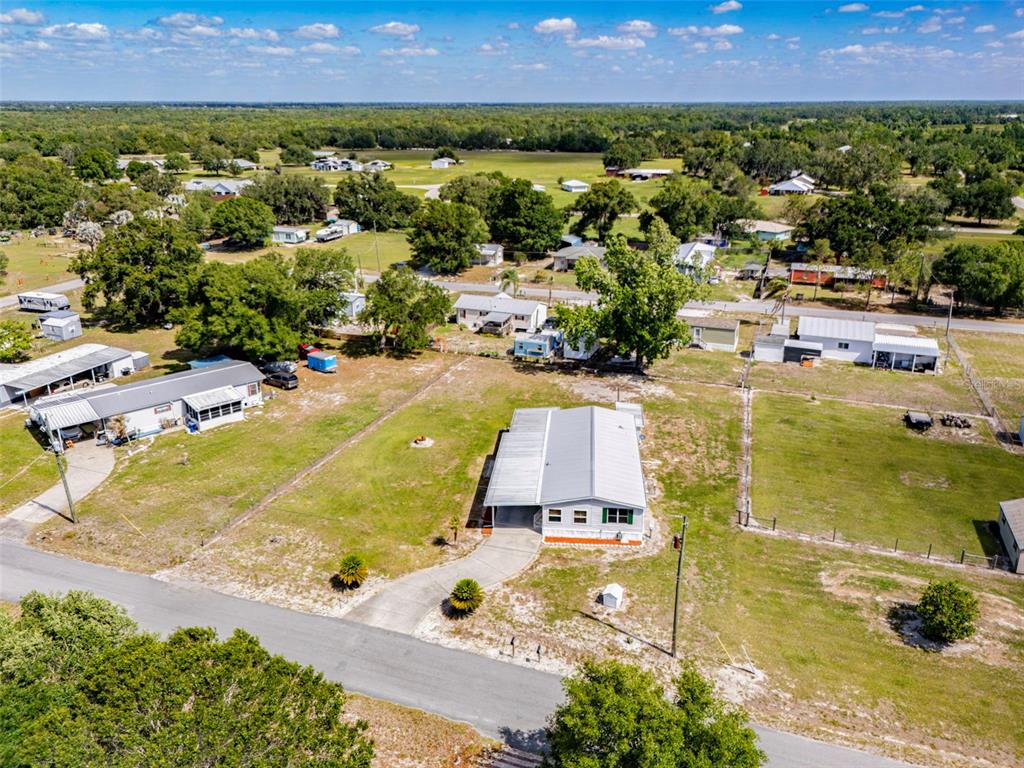 1586 Grapefruit Street Arcadia, FL 34266 - Photo 38 of 40 an aerial view of residential houses with outdoor space