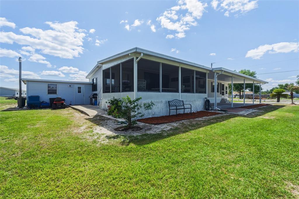 1586 Grapefruit Street Arcadia, FL 34266 - Photo 5 of 40 a front view of a house with a yard and porch