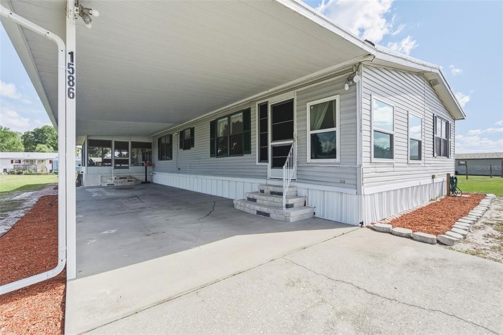 1586 Grapefruit Street Arcadia, FL 34266 - Photo 6 of 40 a front view of a house with patio