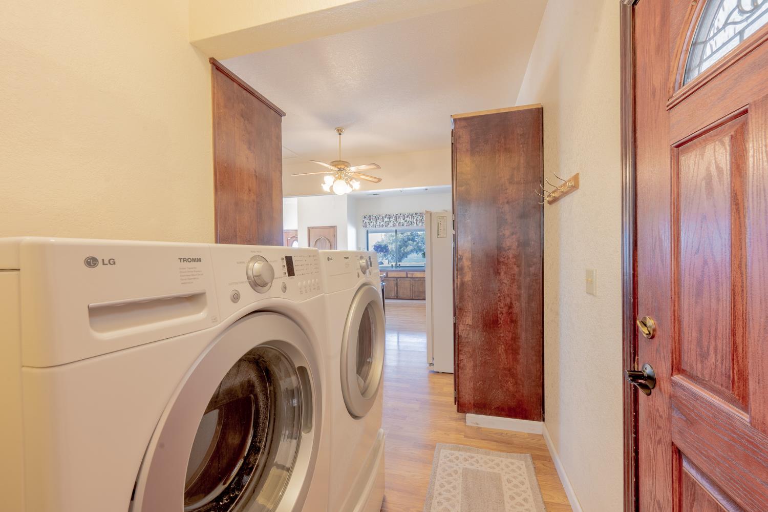 5912 Old Gulch Road San Andreas, CA 95249 - Photo 10 of 71 a view of washer and dryer with kitchen in the background