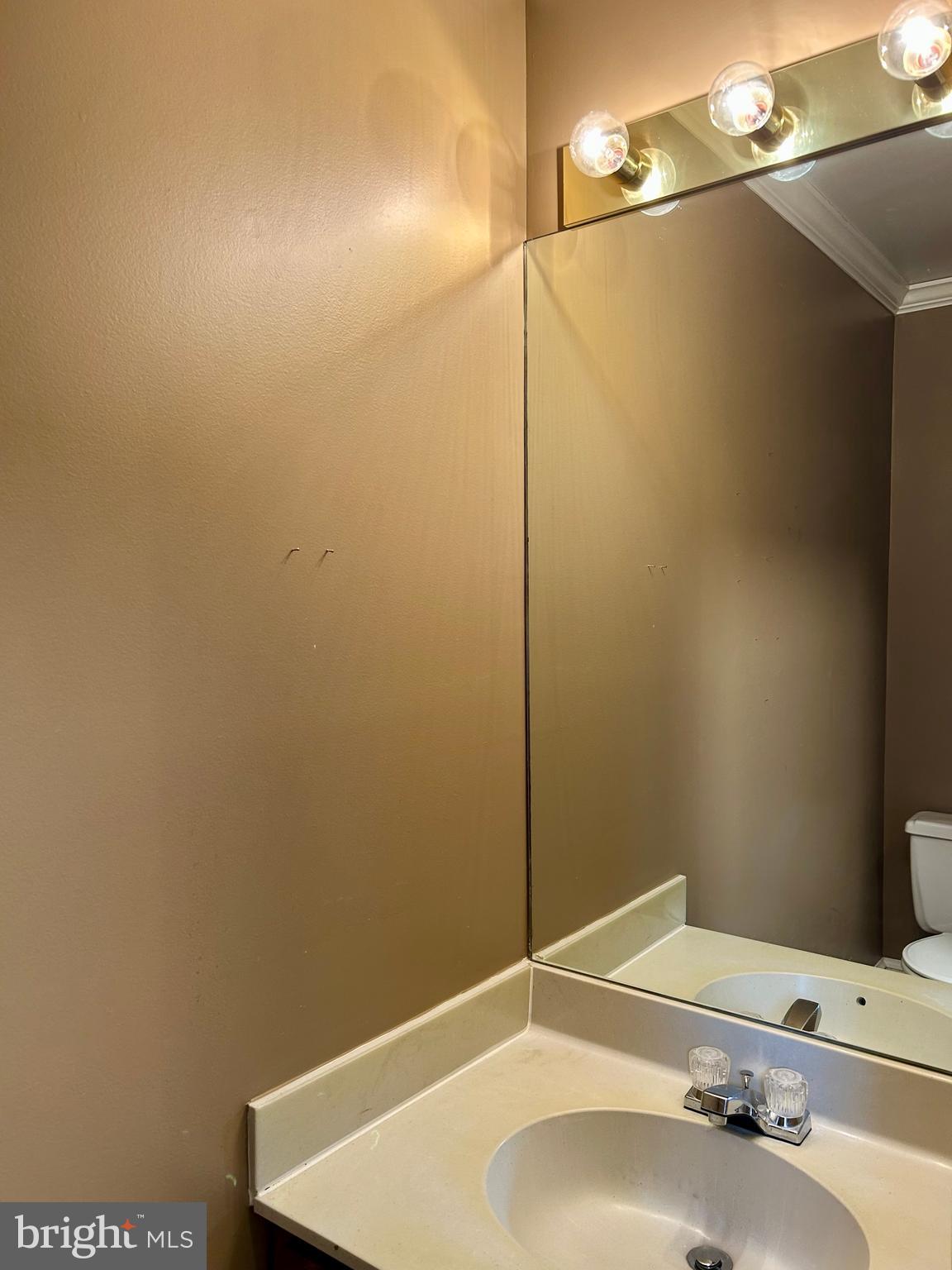 4416 Lingan Road Northwest Washington, DC 20007 - Photo 12 of 59 a bathroom with a sink and a mirror