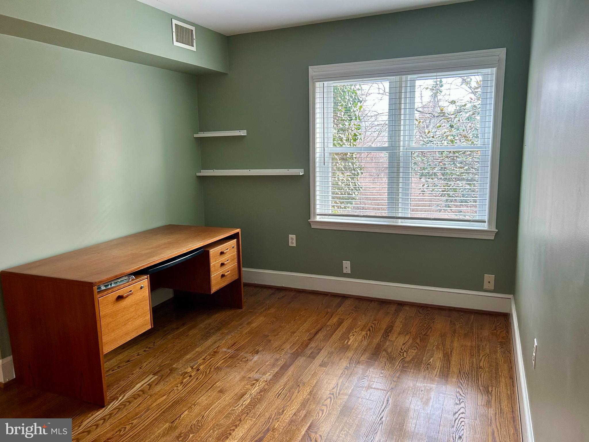 4416 Lingan Road Northwest Washington, DC 20007 - Photo 19 of 59 a room with wooden floor and window