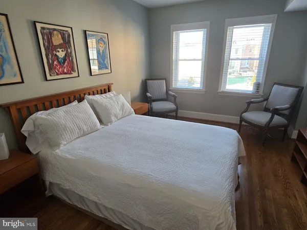 a room with wooden floor and cabinet