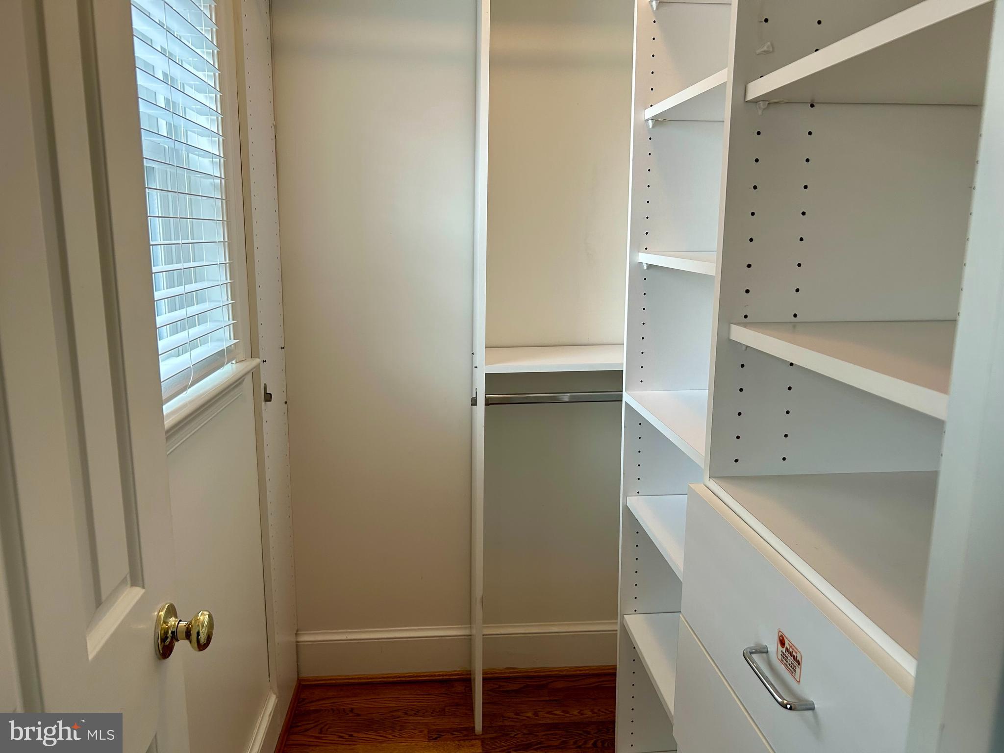 4416 Lingan Road Northwest Washington, DC 20007 - Photo 26 of 59 a room with wooden floor and cabinet