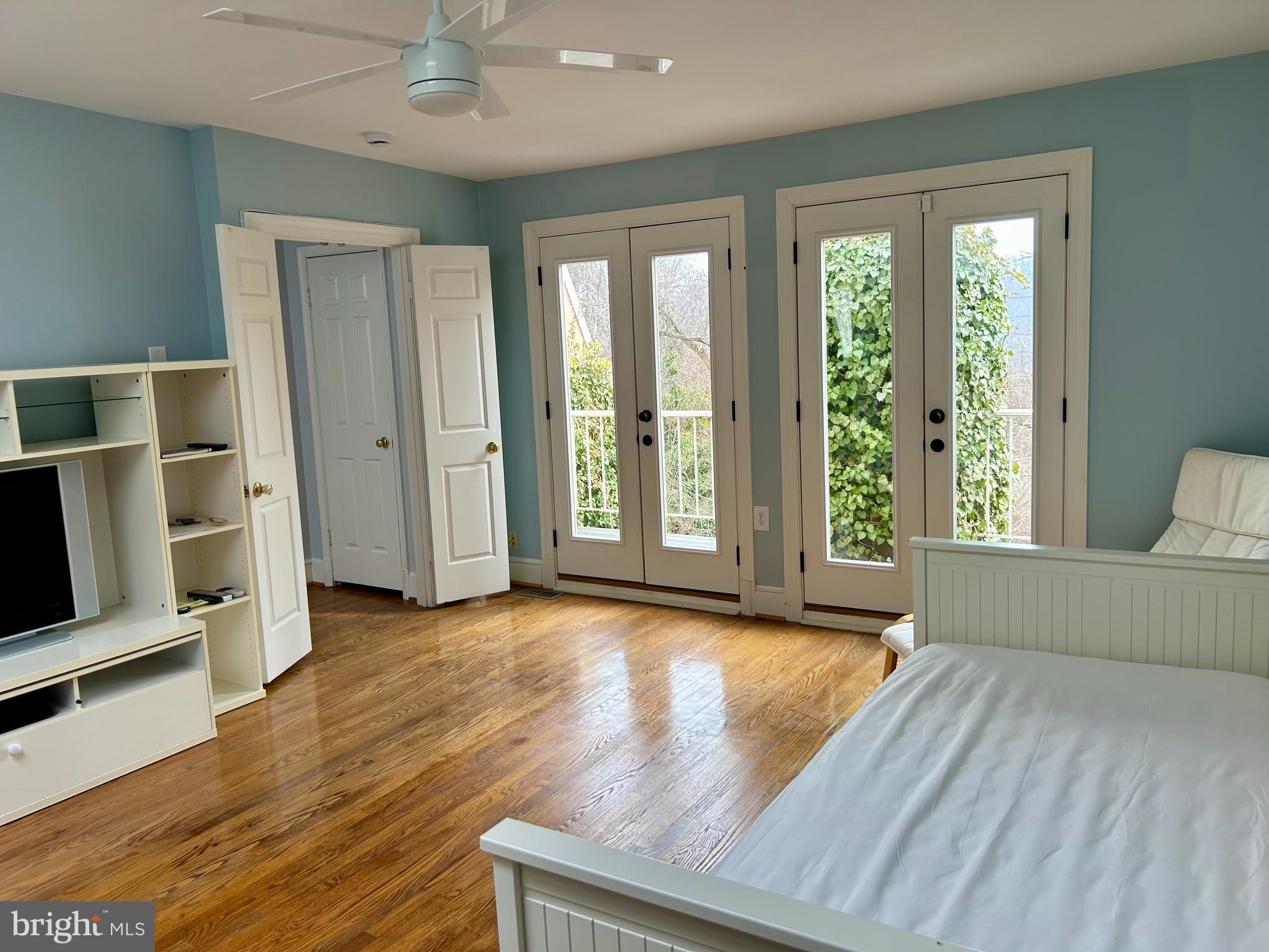 4416 Lingan Road Northwest Washington, DC 20007 - Photo 32 of 59 a view of an empty room with a window and wooden floor