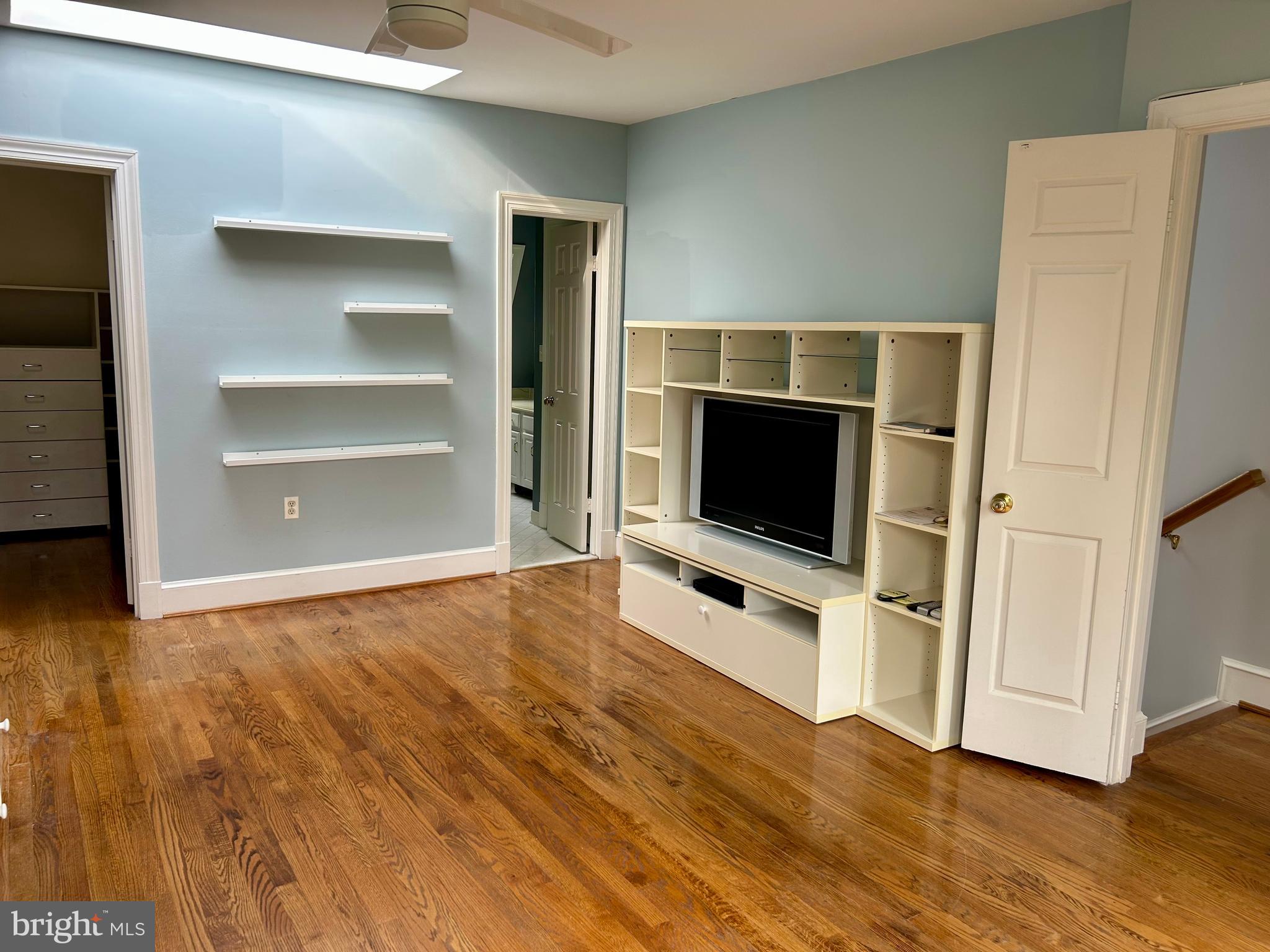 4416 Lingan Road Northwest Washington, DC 20007 - Photo 34 of 59 a view of a livingroom with an empty space and wooden floor