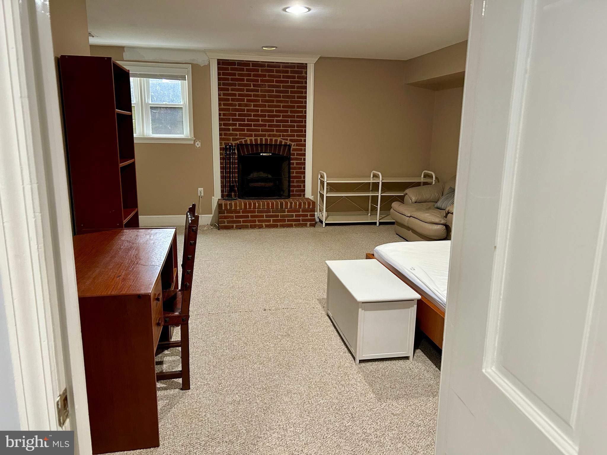 4416 Lingan Road Northwest Washington, DC 20007 - Photo 47 of 59 a living room with furniture and a fireplace