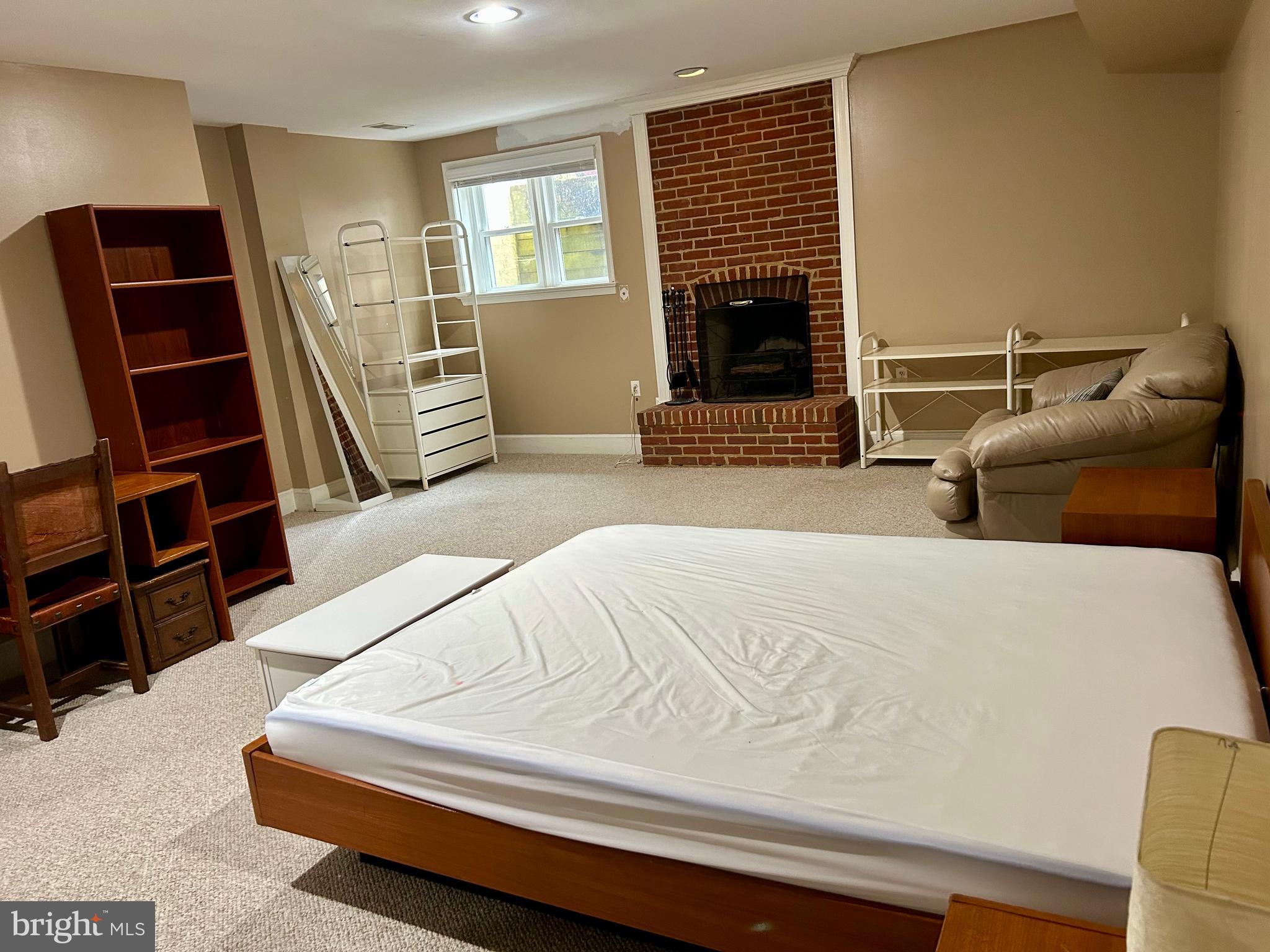 4416 Lingan Road Northwest Washington, DC 20007 - Photo 48 of 59 a bedroom with furniture and a window