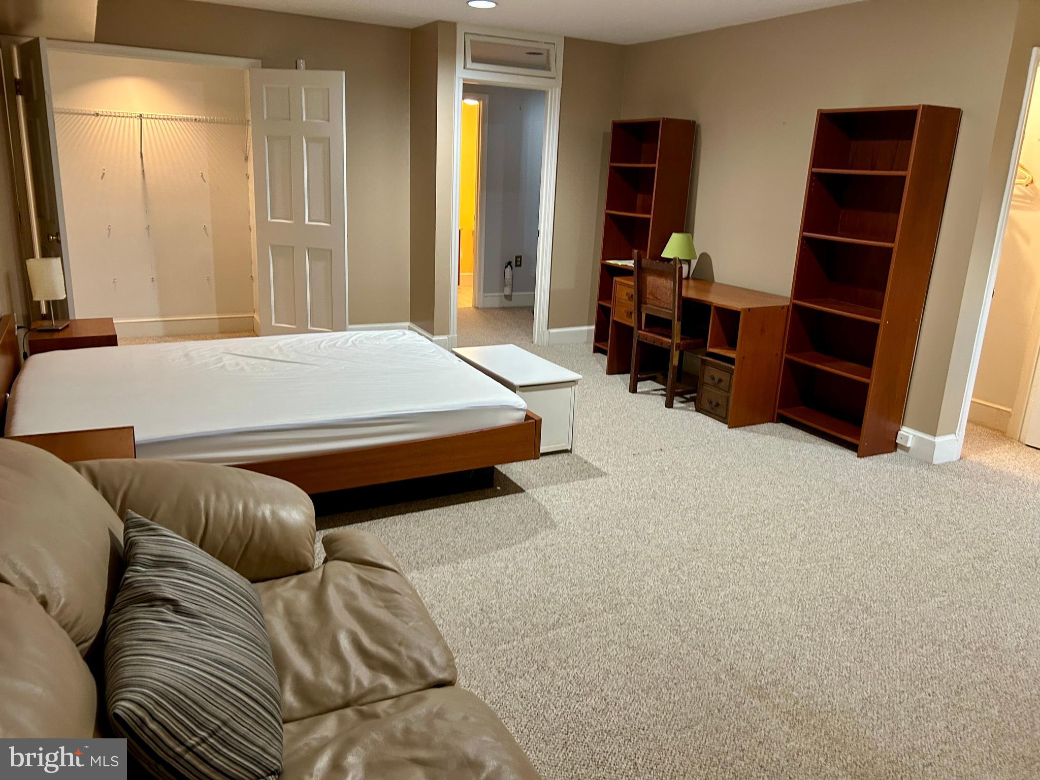 4416 Lingan Road Northwest Washington, DC 20007 - Photo 49 of 59 a bed room with a bed and a television