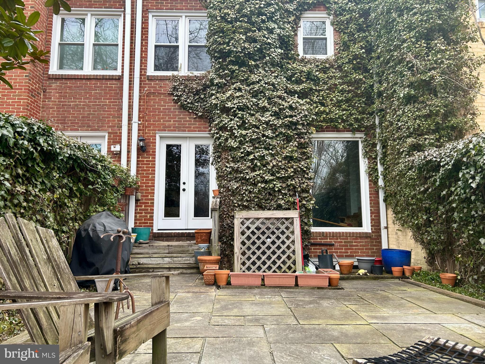 4416 Lingan Road Northwest Washington, DC 20007 - Photo 55 of 59 a view of a house with backyard and sitting area