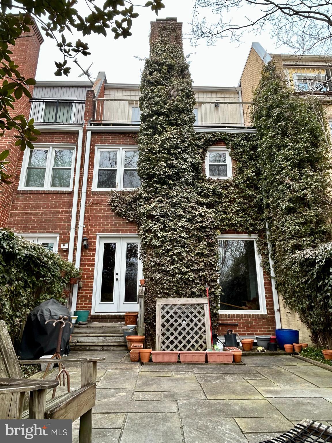4416 Lingan Road Northwest Washington, DC 20007 - Photo 56 of 59 front view of a brick house with a small yard