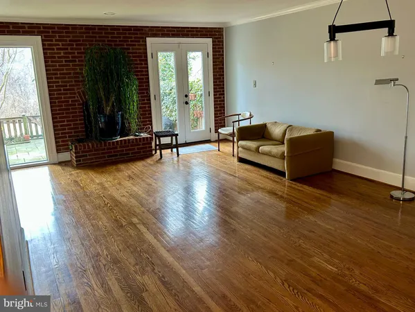 a room with furniture and large windows
