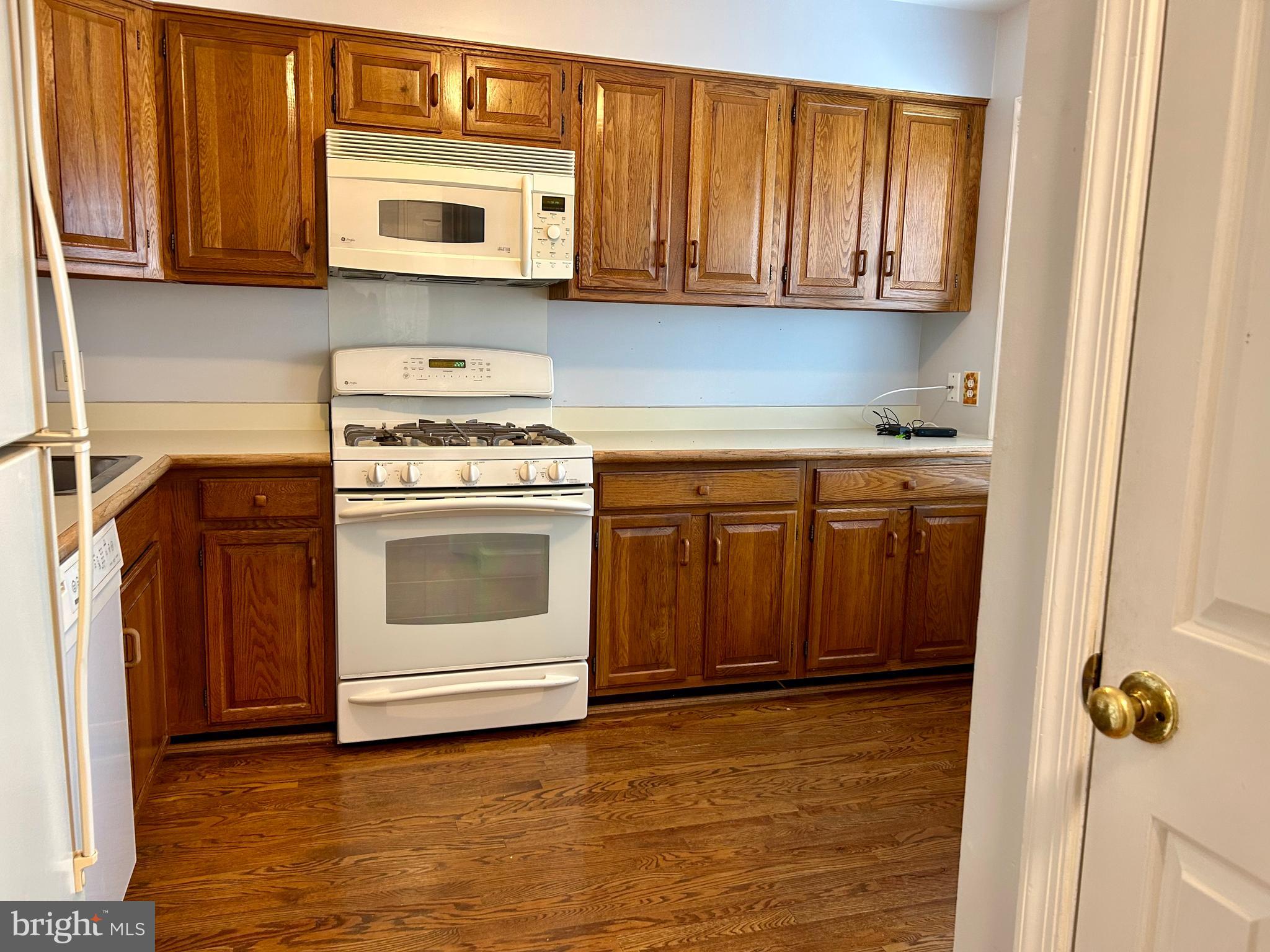 4416 Lingan Road Northwest Washington, DC 20007 - Photo 10 of 59 a kitchen with stainless steel appliances granite countertop a stove and a microwave