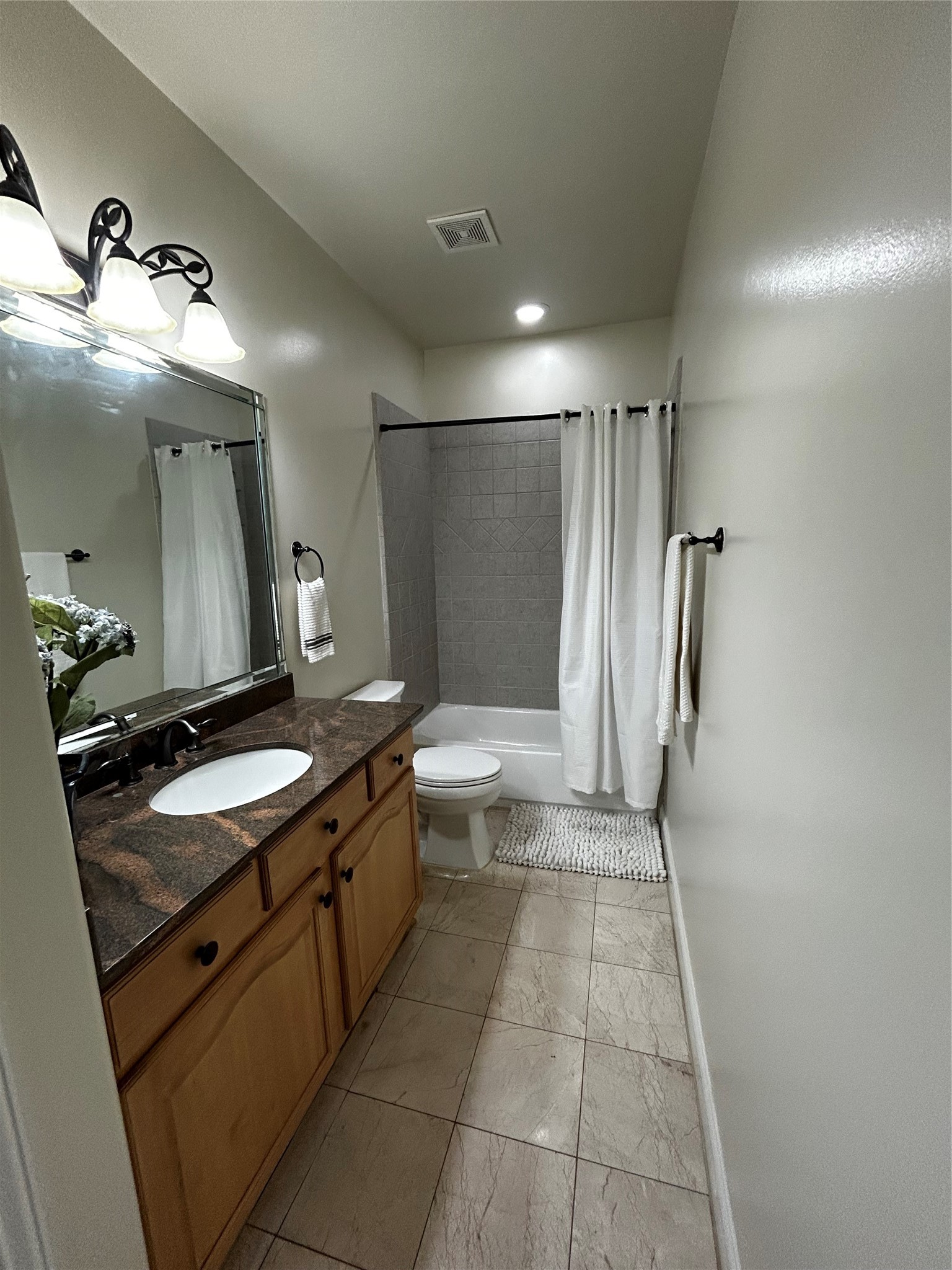 4406 Crawford Street Houston, TX 77004 - Photo 12 of 19 a bathroom with a double vanity sink and mirror
