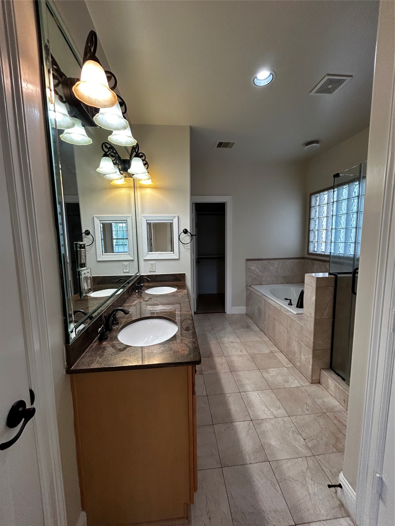 4406 Crawford Street Houston, TX 77004 - Photo 4 of 19 a bathroom with a sink a mirror and a shower