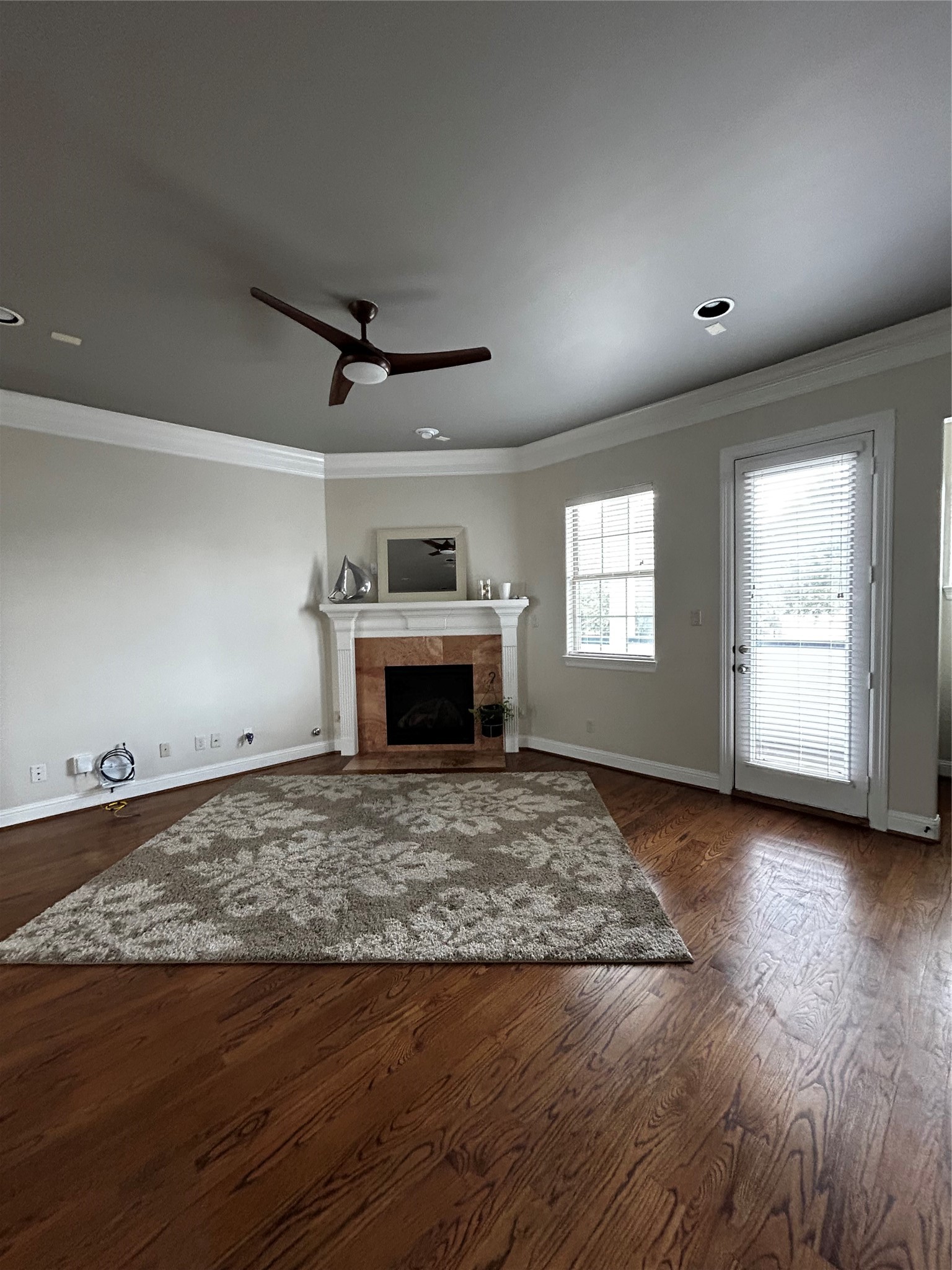 4406 Crawford Street Houston, TX 77004 - Photo 10 of 19 a view of empty room with wooden floor and fireplace