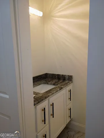 wooden floor with white walls