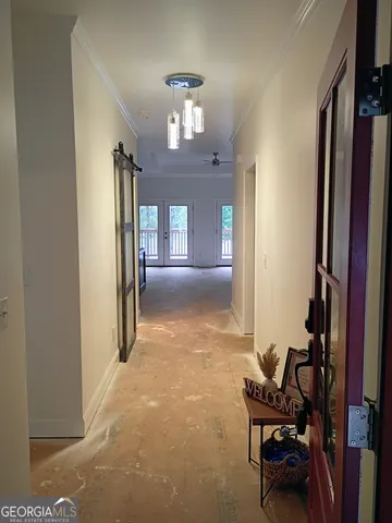 a view of a hallway to a door