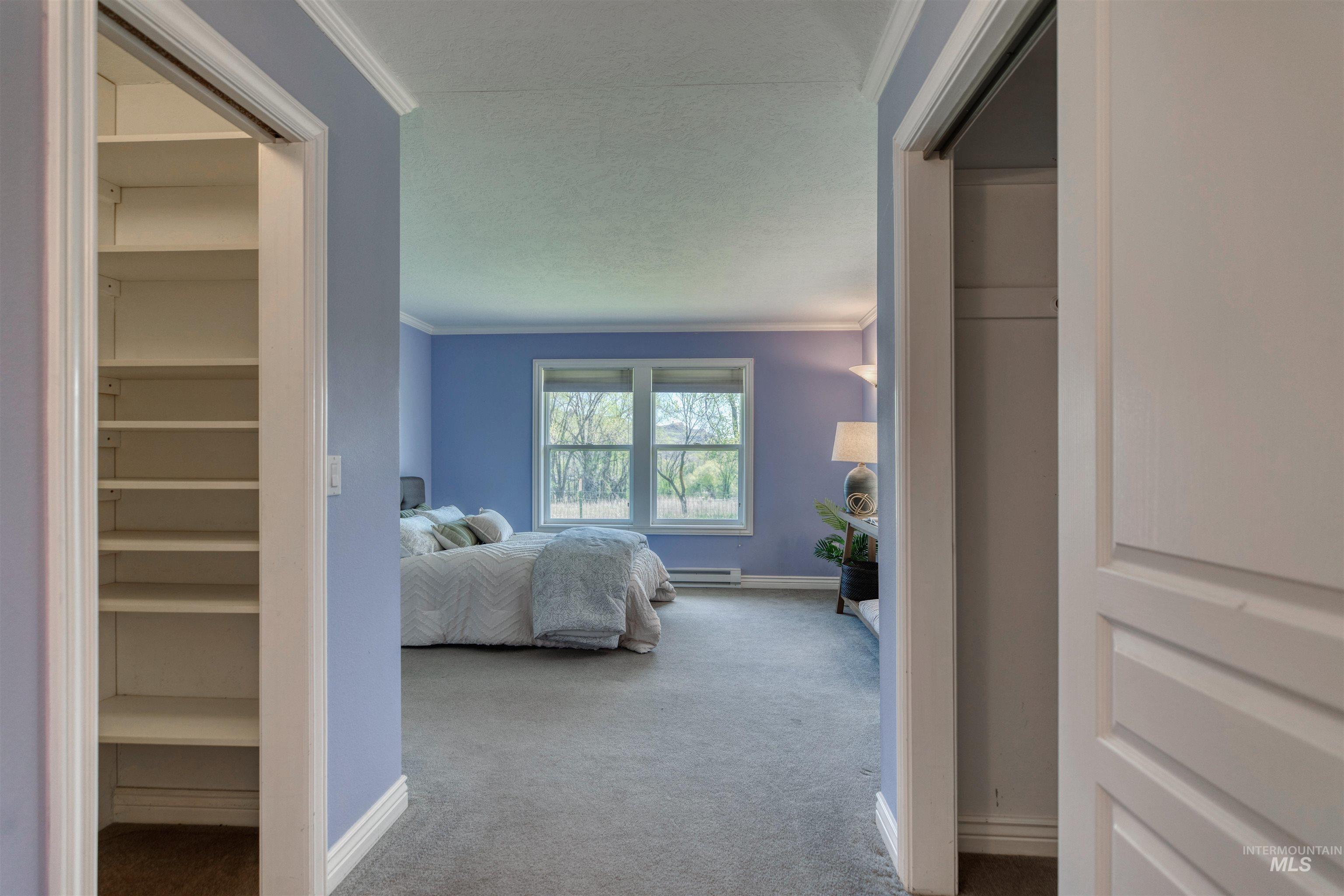 1295 15th Street Vale, OR 97918 - Photo 15 of 50 Bedroom with crown molding, carpet, and a baseboard radiator