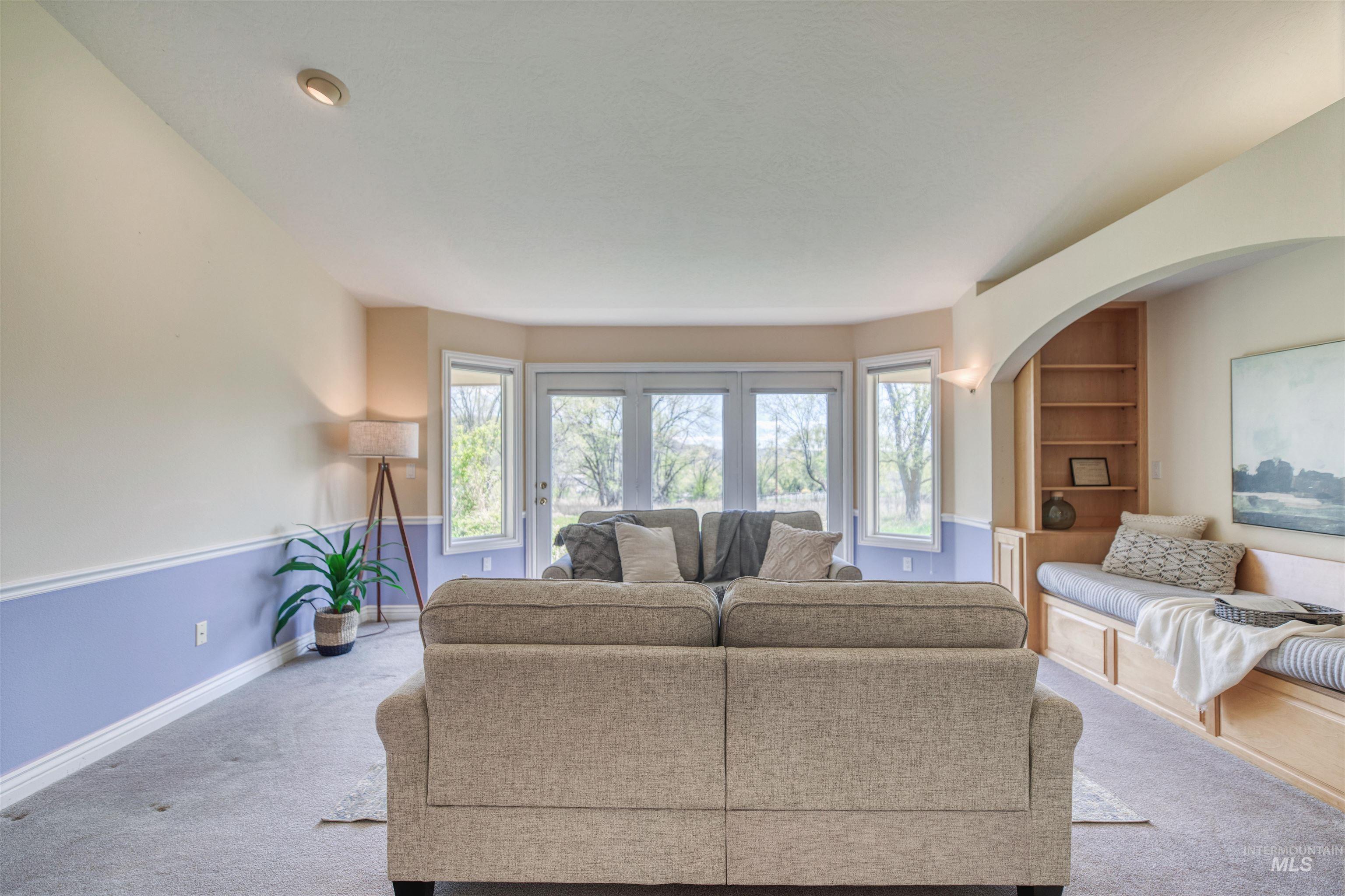 1295 15th Street Vale, OR 97918 - Photo 4 of 50 Living room featuring carpet floors and built in features