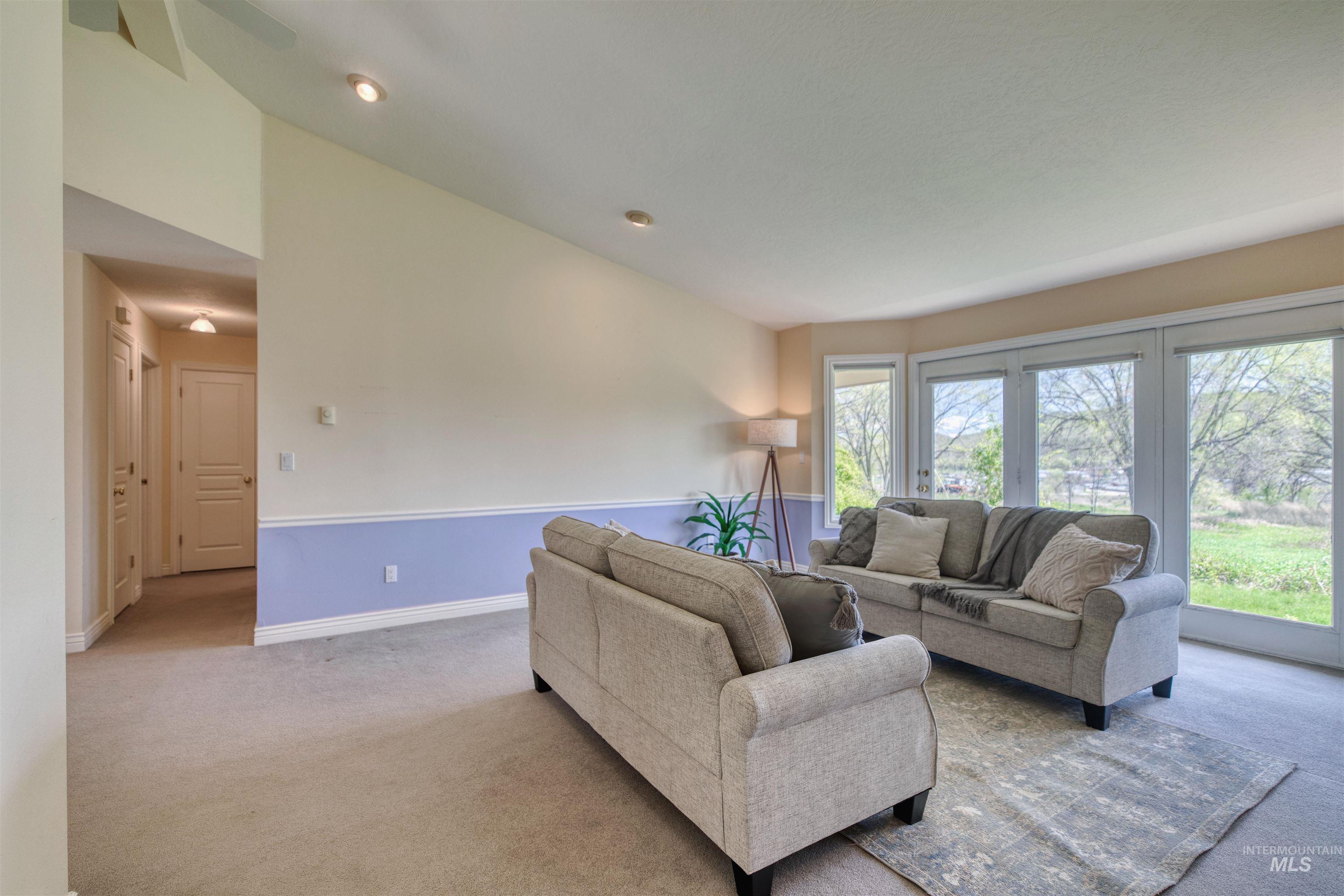 1295 15th Street Vale, OR 97918 - Photo 5 of 50 Living area with carpet floors and lofted ceiling