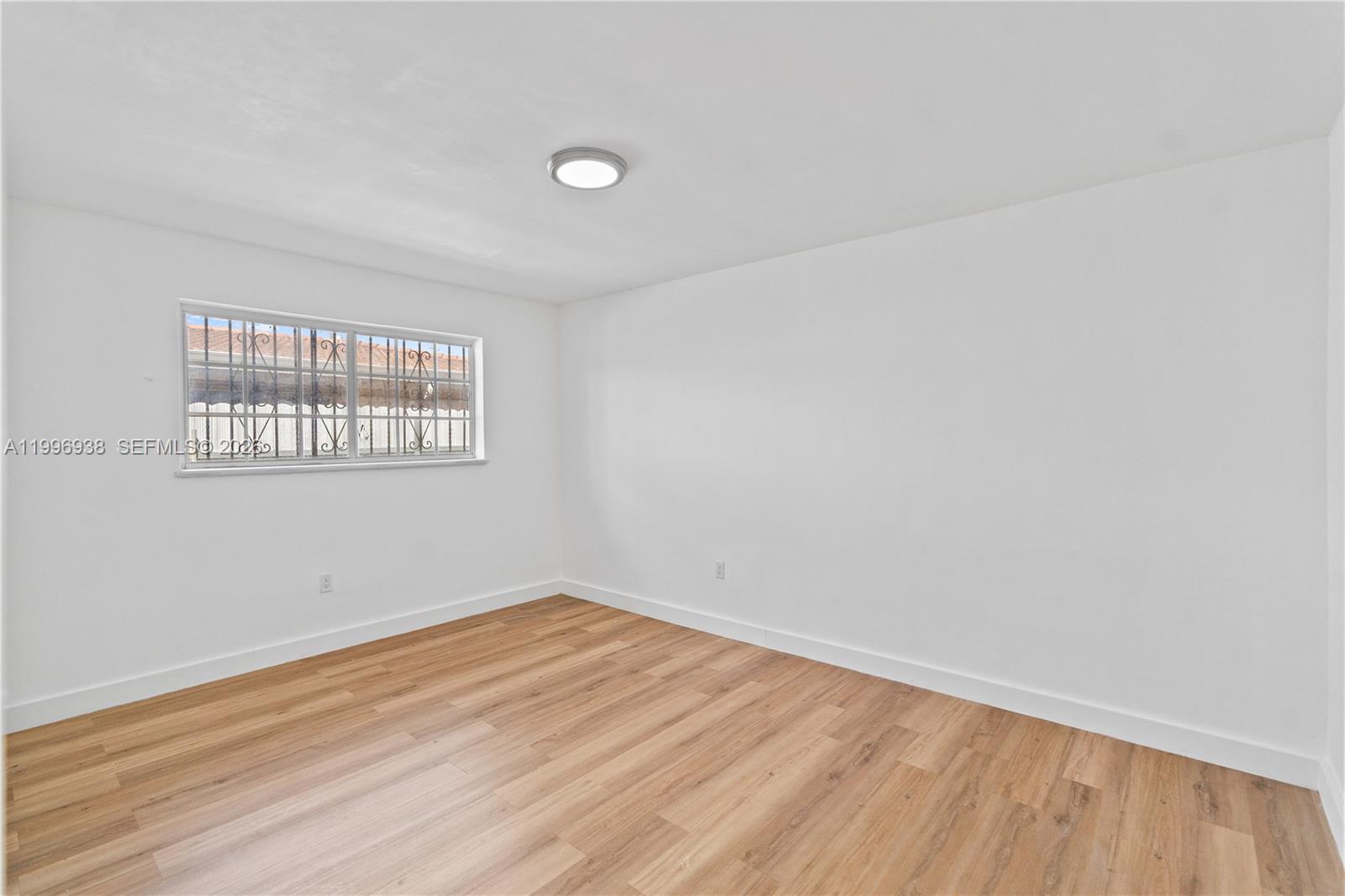 361 East 39th Street, Unit 1 Hialeah, FL 33013 - Photo 13 of 47 an empty room with a window