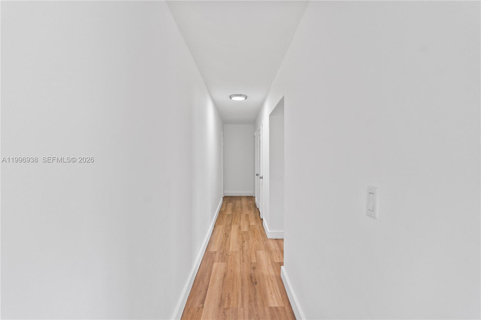 361 East 39th Street, Unit 1 Hialeah, FL 33013 - Photo 15 of 47 a view of a room with wooden floor