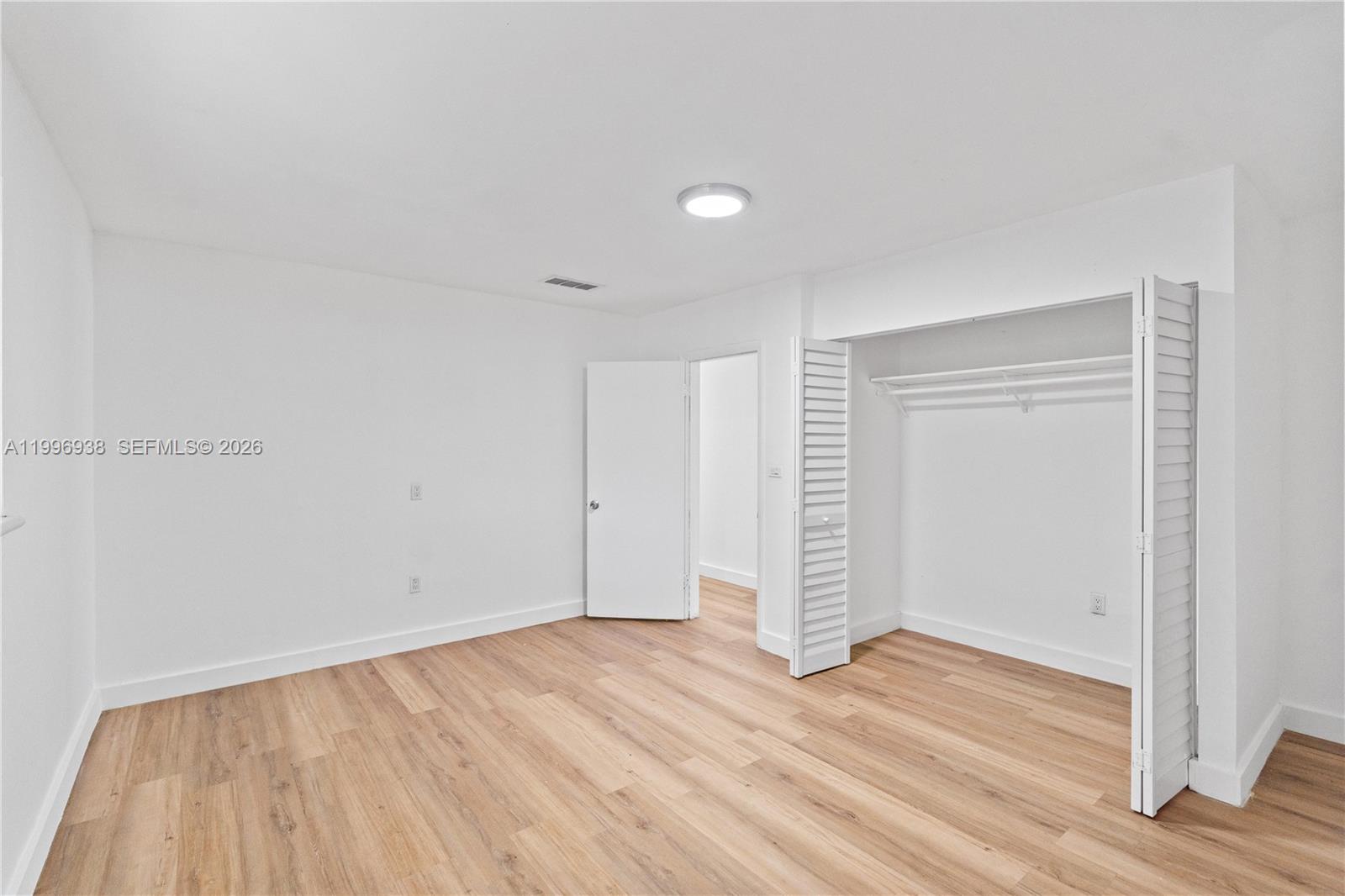 361 East 39th Street, Unit 1 Hialeah, FL 33013 - Photo 25 of 47 wooden floor in an empty room