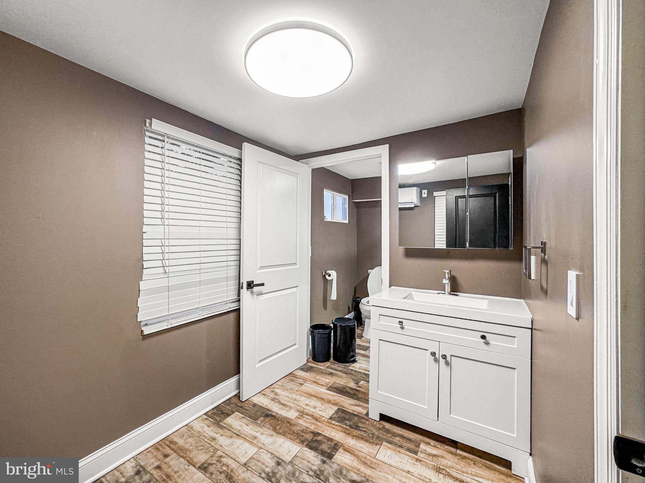 223 Main Street Hamilton, NJ 08620 - Photo 14 of 22 a spacious bathroom with a double vanity sink and mirror