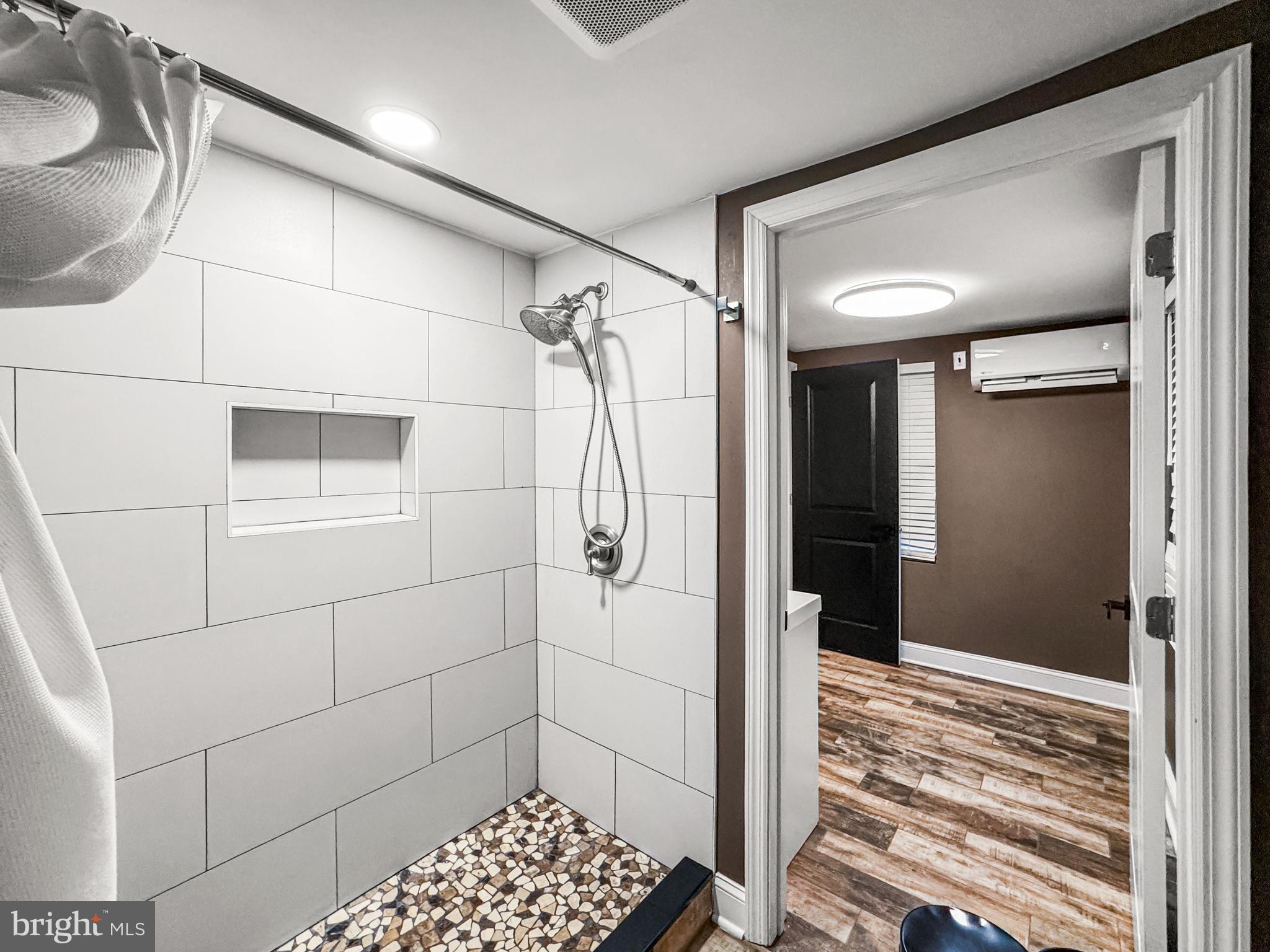 223 Main Street Hamilton, NJ 08620 - Photo 16 of 22 a bathroom with a shower and a sink