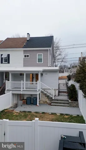 a view of a house with a balcony and chair
