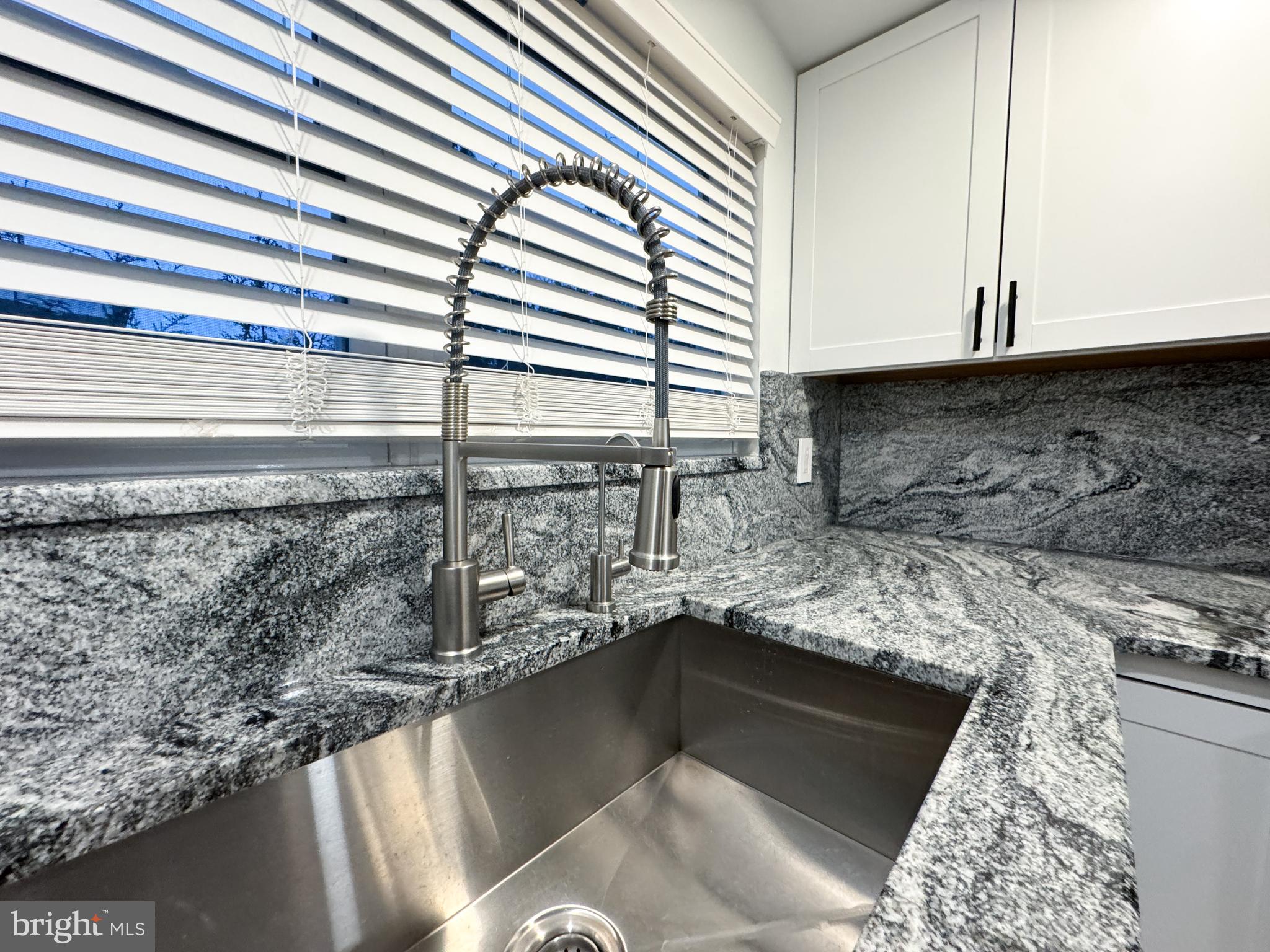 223 Main Street Hamilton, NJ 08620 - Photo 6 of 22 a kitchen with a sink and a stove