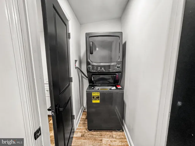 a bathroom with a toilet and a mirror