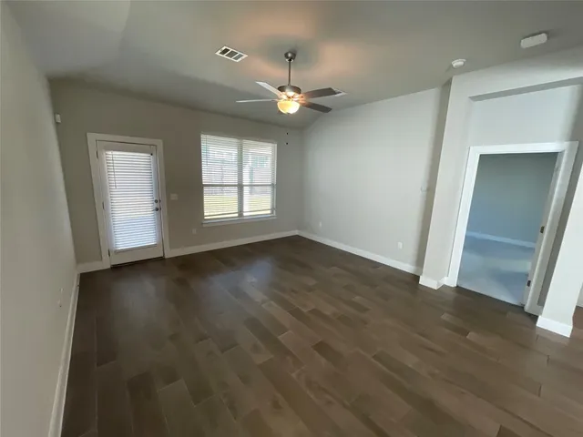 a kitchen with refrigerator a sink and cabinets