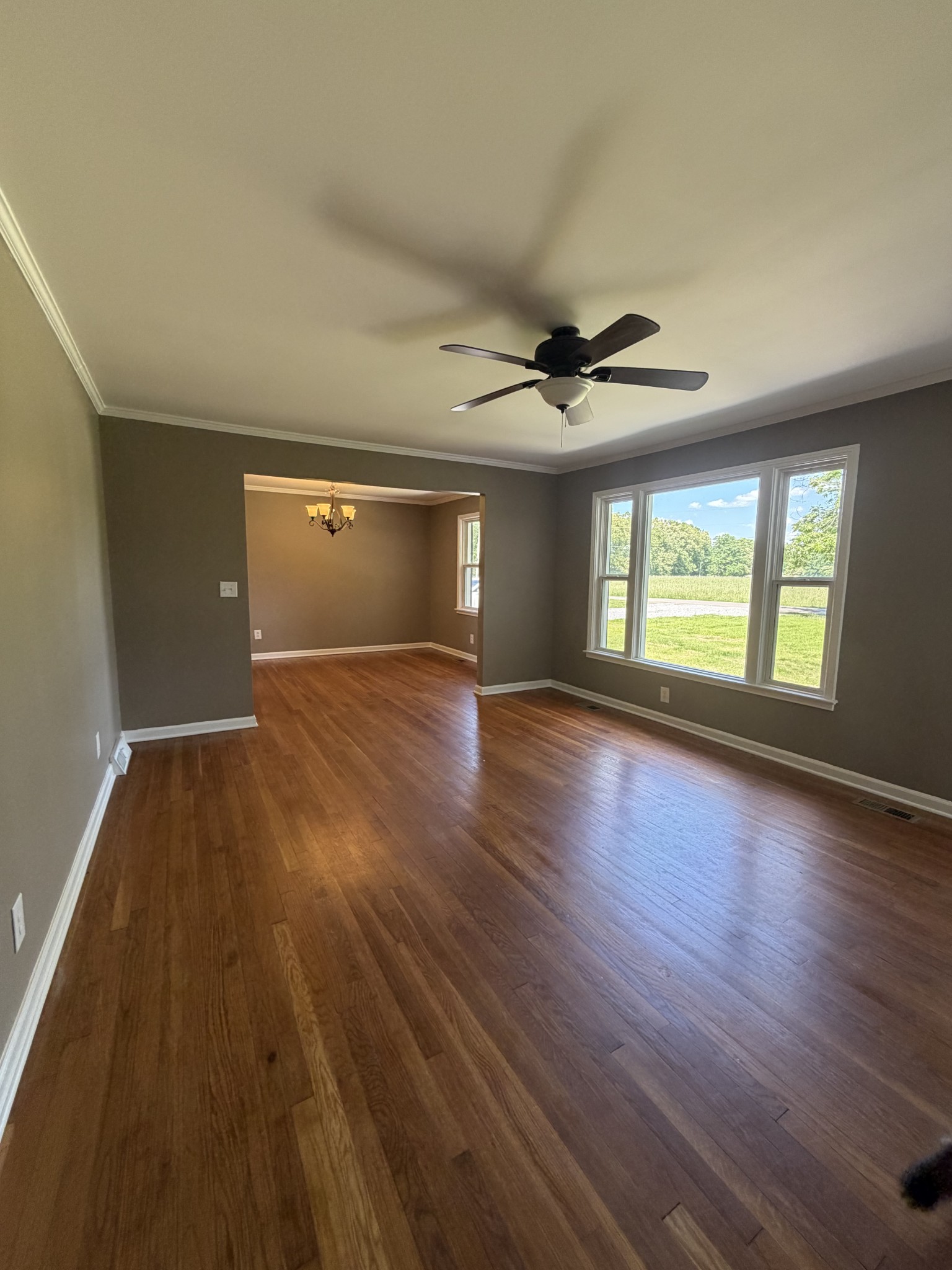 2280 Graham Cemetery Road Clarksville, TN 37043 - Photo 4 of 19 a view of an empty room with a window and wooden floor