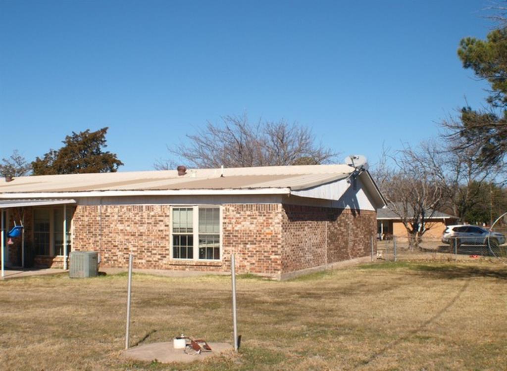 511 California Street Clyde, TX 79510 - Photo 11 of 13 a front view of a house with a yard