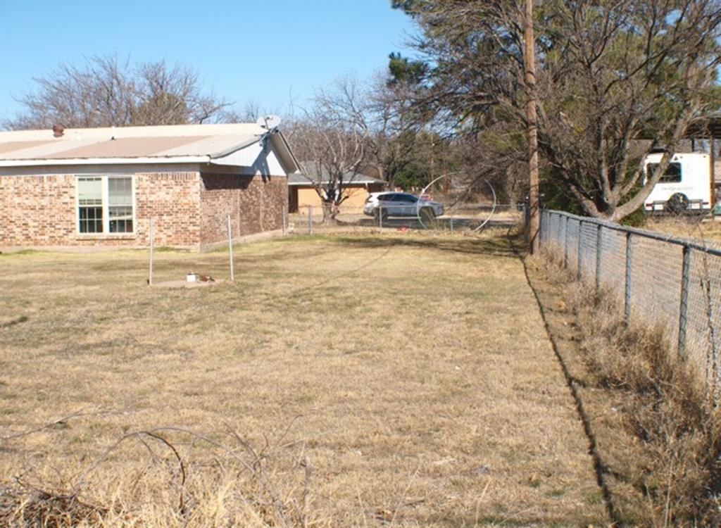 511 California Street Clyde, TX 79510 - Photo 12 of 13 a view of a house with backyard and tree