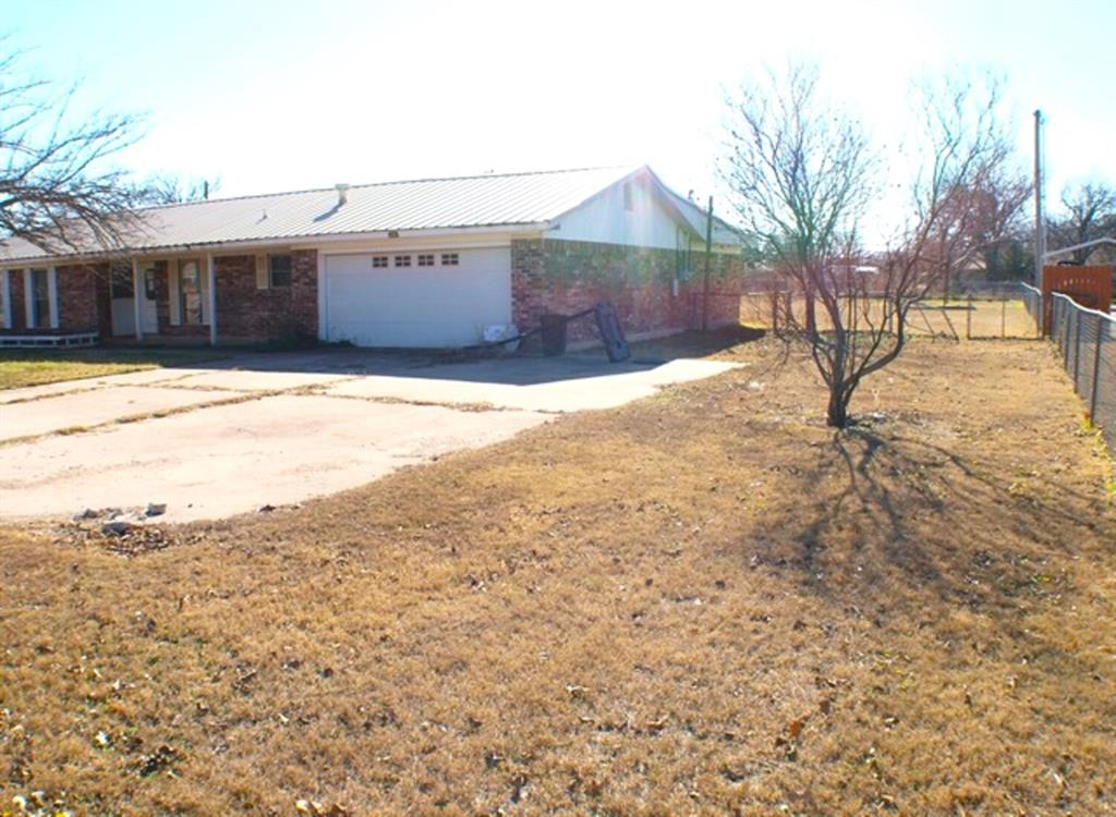 511 California Street Clyde, TX 79510 - Photo 2 of 13 a view of a yard with a large tree