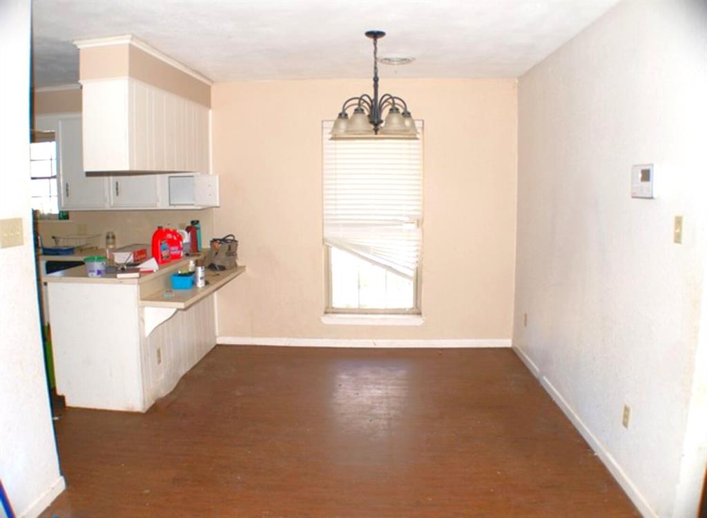 511 California Street Clyde, TX 79510 - Photo 4 of 13 a bathroom with a sink cabinets and a window