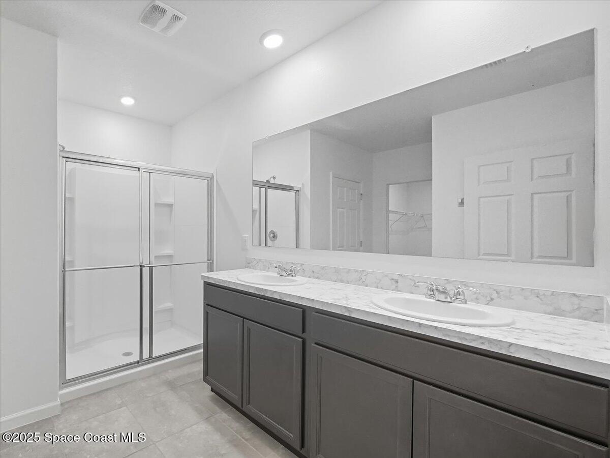 352 Catfish Place Cocoa, FL 32927 - Photo 21 of 30 a bathroom with a granite countertop sink and a mirror