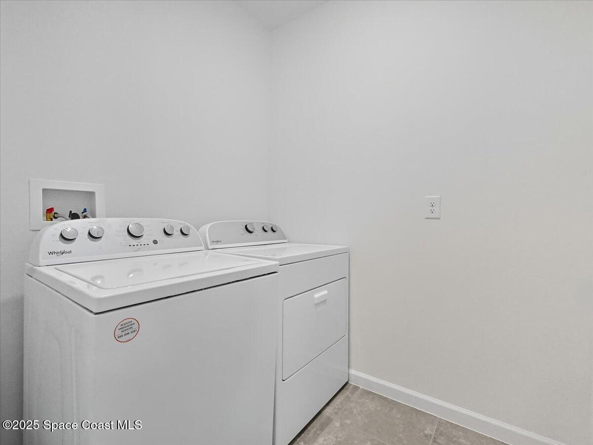 352 Catfish Place Cocoa, FL 32927 - Photo 22 of 30 a utility room with dryer and washer