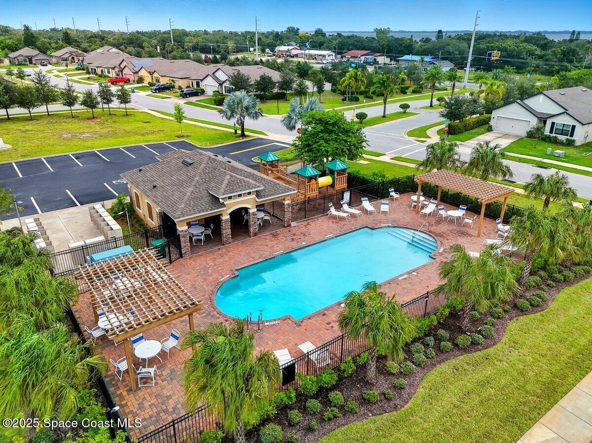 352 Catfish Place Cocoa, FL 32927 - Photo 27 of 30 an aerial view of a house with a swimming pool yard and outdoor seating