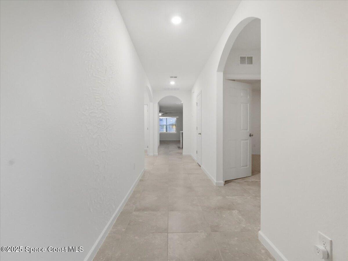 352 Catfish Place Cocoa, FL 32927 - Photo 4 of 30 a view of a room with a hallway