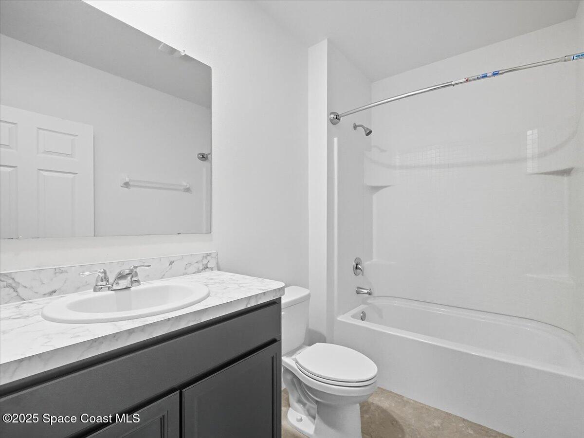 352 Catfish Place Cocoa, FL 32927 - Photo 7 of 30 a bathroom with a sink a toilet and shower
