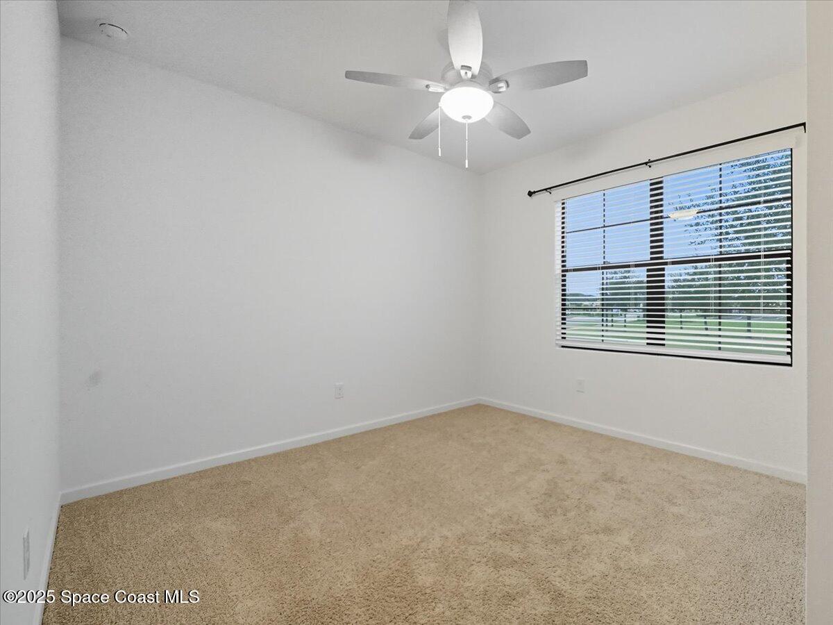 352 Catfish Place Cocoa, FL 32927 - Photo 8 of 30 a view of an empty room with a window