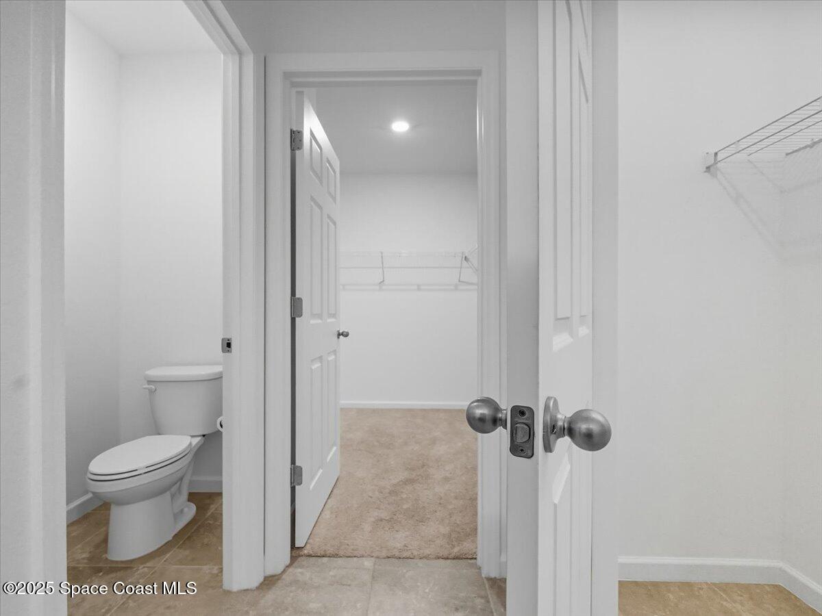 352 Catfish Place Cocoa, FL 32927 - Photo 10 of 30 a bathroom with a toilet and a shower