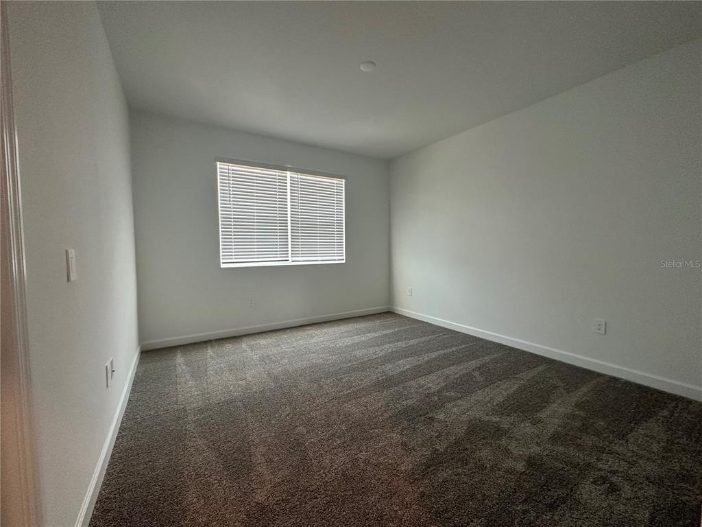 3128 Addison Boulevard St. Cloud, FL 34771 - Photo 13 of 35 an empty room with a window