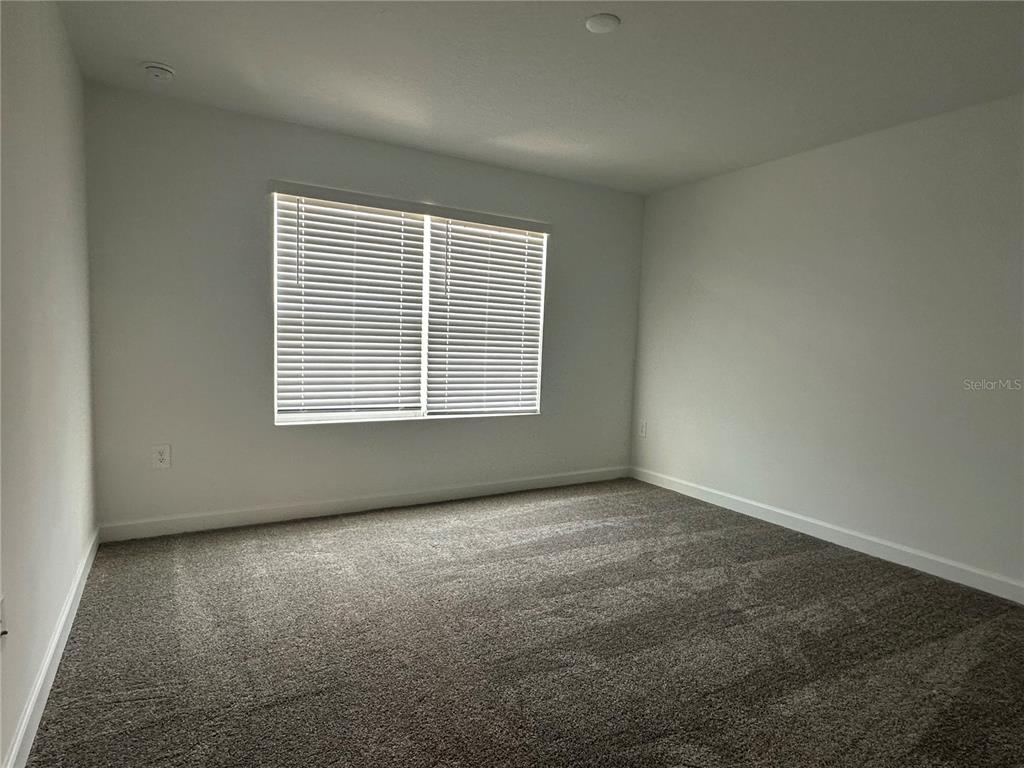 3128 Addison Boulevard St. Cloud, FL 34771 - Photo 19 of 35 an empty room with a window